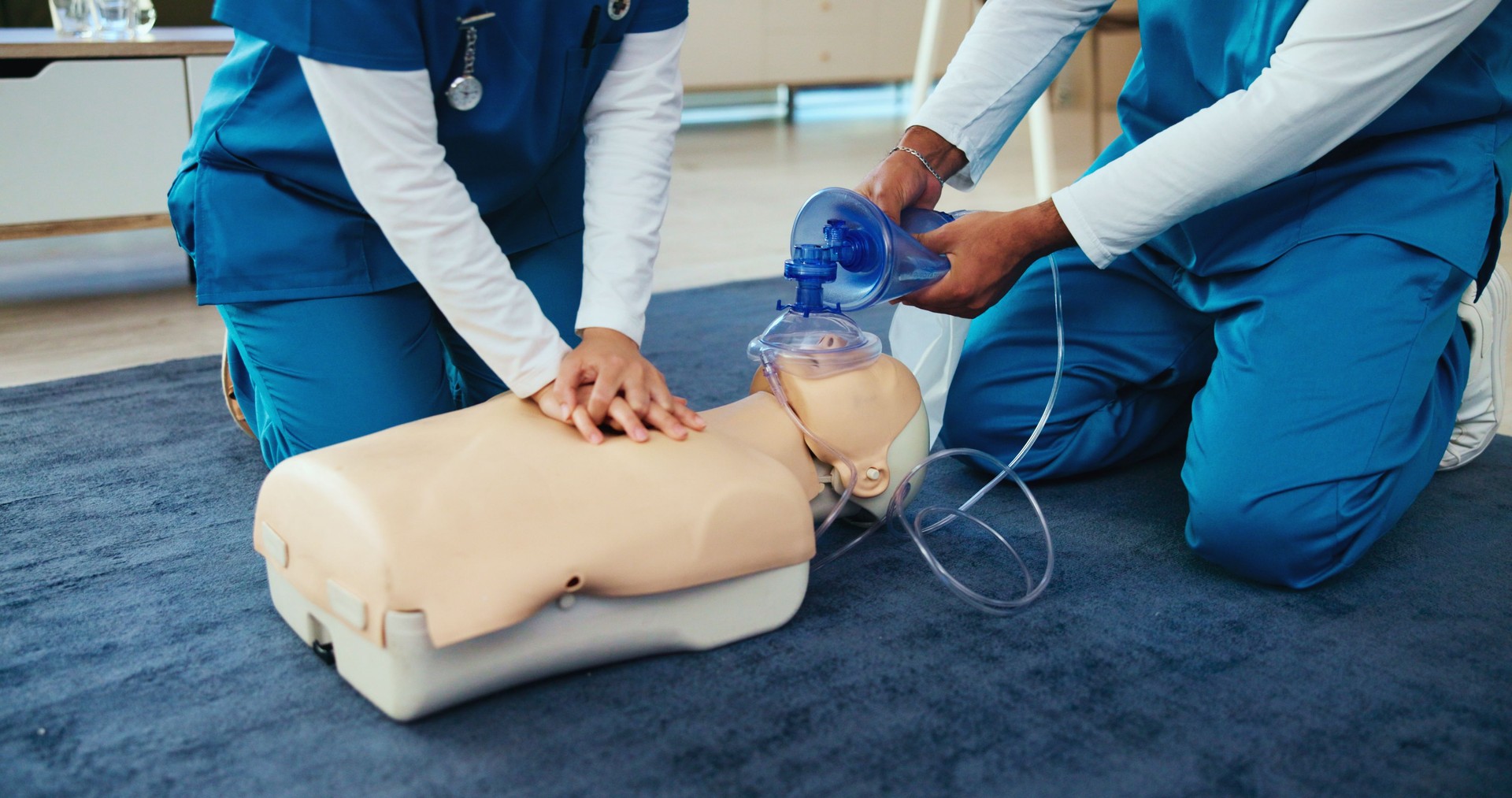 Mask, medical or nurses learning cpr on mannequin for first aid, help cardiac arrest or safety protocol. Healthcare class, hands or people with respiratory tool in paramedic course or nursing school